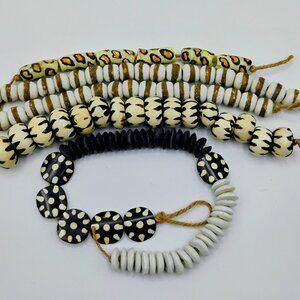 Detash beads lot: Black, white and orange cheetah focal bead lot